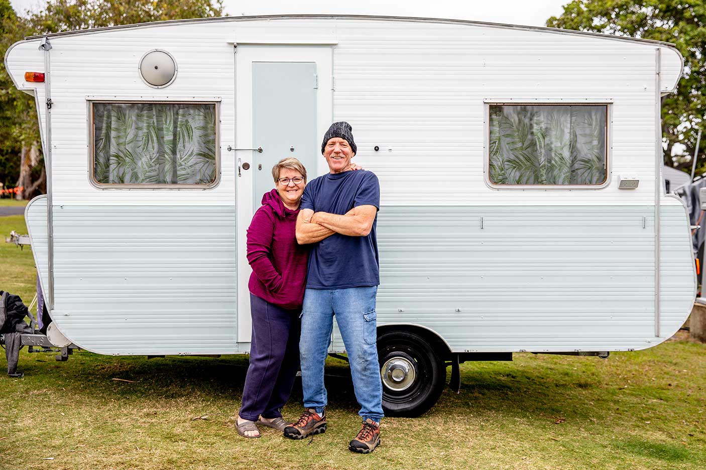 Grandparents with grandkids at campground with their caravan.