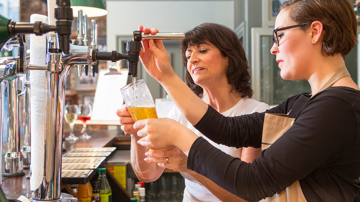 Learning to pour a beer behind the bar